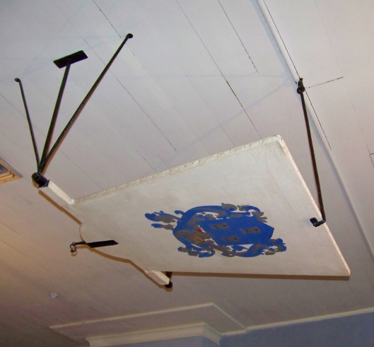 This fan, over the dining room table, would be operated by a slave. It was often called a "shoo-fly" fan.