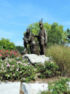 A statue stands as a tribute to the Corps of Discovery, and to Lewis and Clark, in Frontier Park.