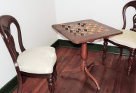 A friendly game of checkers is set up in one of the rooms.